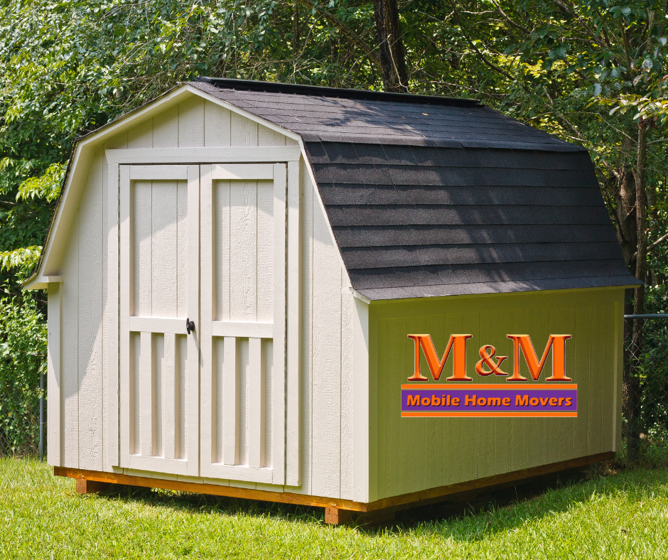 A shed with M&M mobile home movers logo